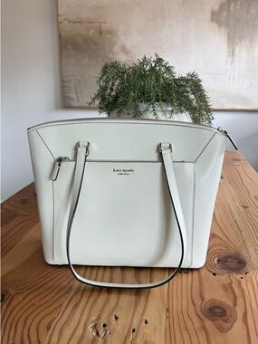 kate spade leather tote with black-edged straps